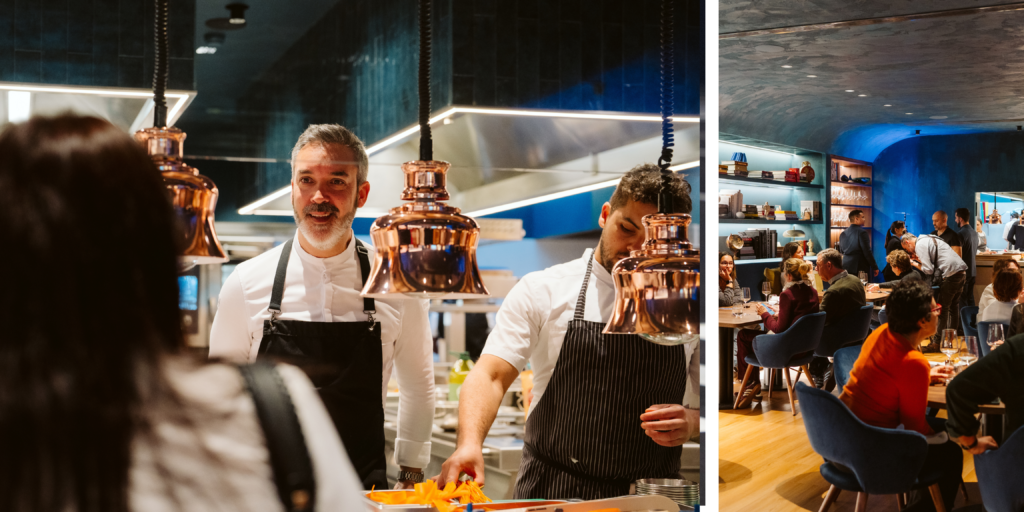 Cocineros trabajando en cocina abierta durante cena gastronómica en Lisboa